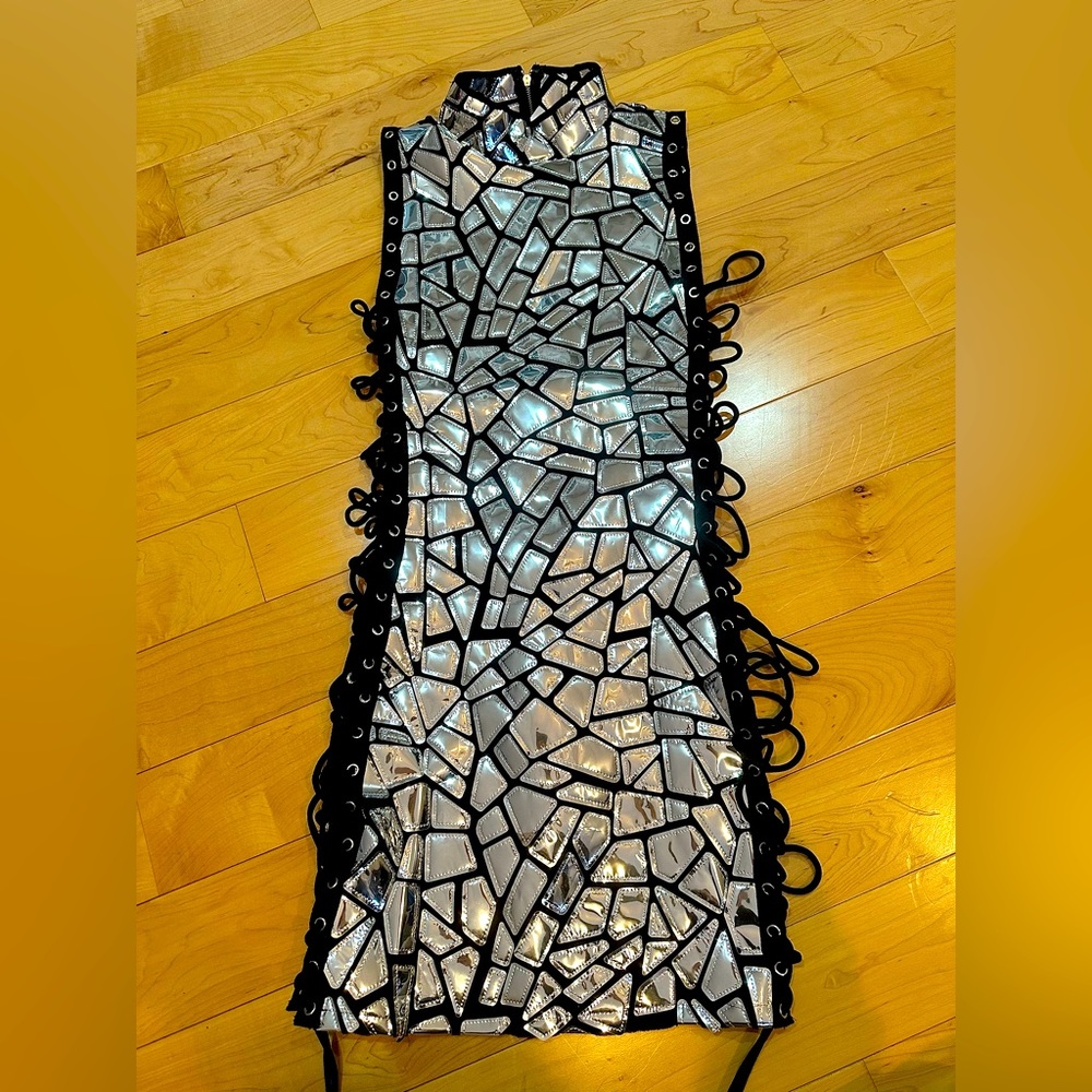 Never worn. Super cute dress with open sides.Perfect for a night out or vacation